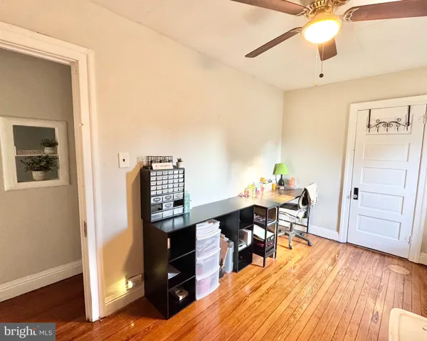 a room with furniture and wooden floor