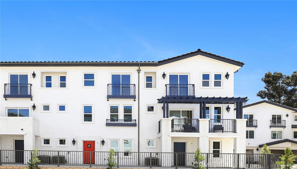 15 Turnberry Lane Phillips Ranch, CA 91766 - Photo 1 of 63 a front view of a large residential apartment building
