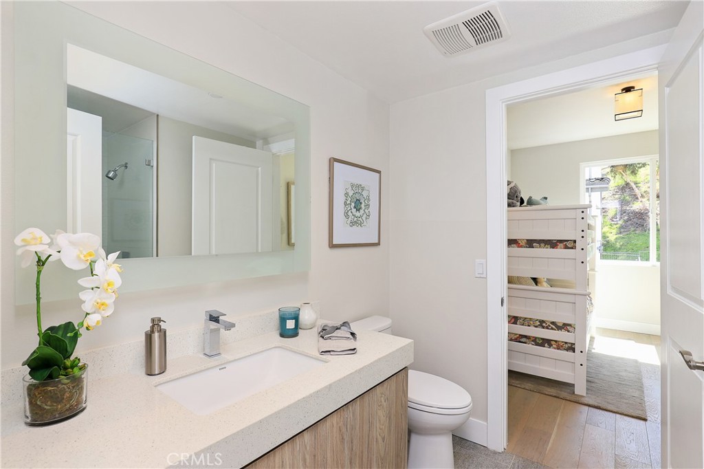 15 Turnberry Lane Phillips Ranch, CA 91766 - Photo 20 of 63 a bathroom with a sink a toilet and a mirror