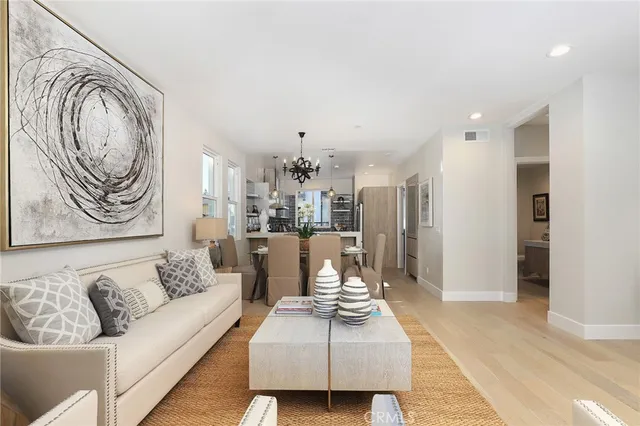 a spacious bedroom with a large bed and a large window