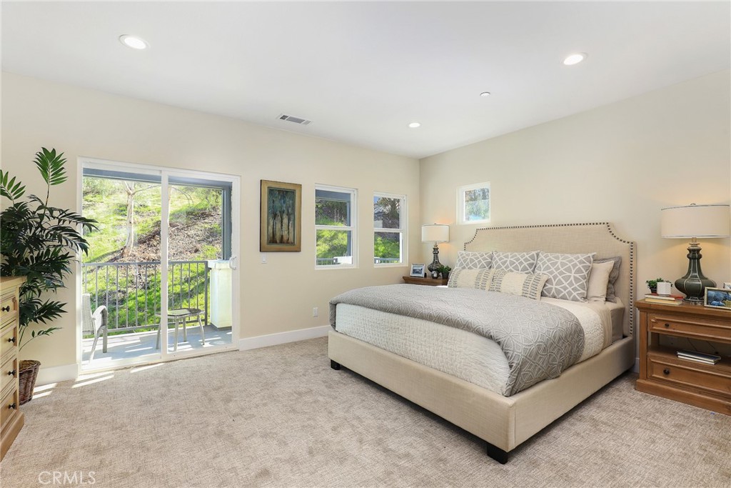 15 Turnberry Lane Phillips Ranch, CA 91766 - Photo 41 of 63 a spacious bedroom with a large bed and a large window