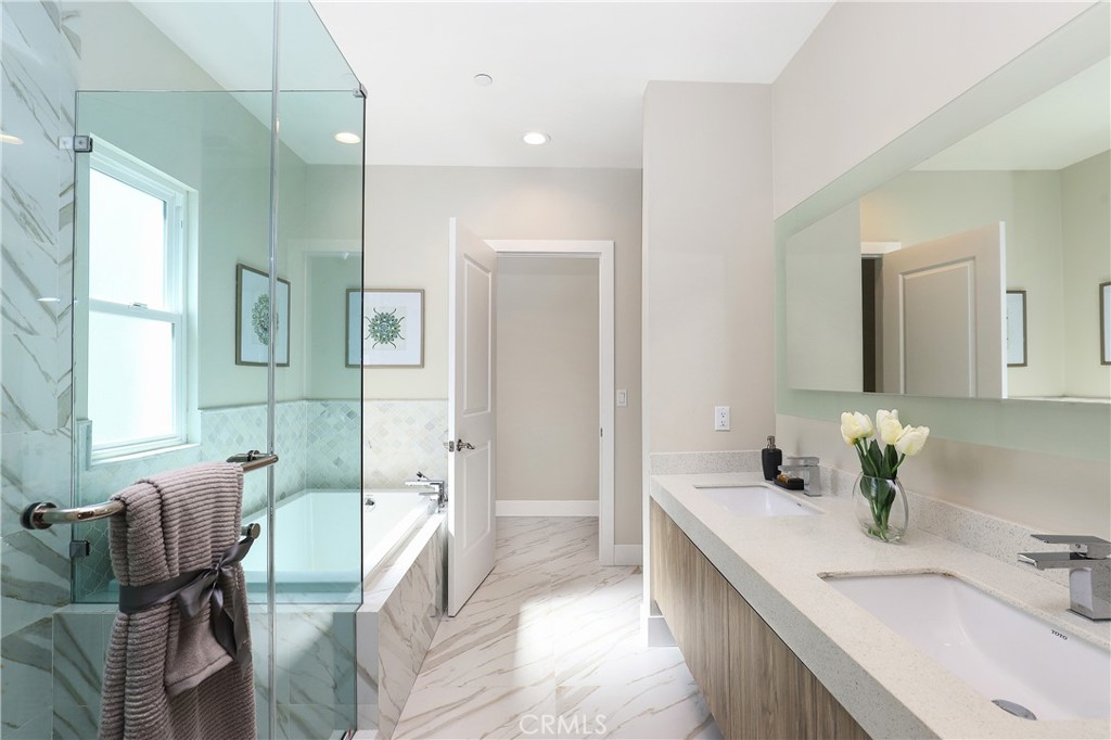 15 Turnberry Lane Phillips Ranch, CA 91766 - Photo 42 of 63 a spacious bathroom with a granite countertop tub sink and mirror