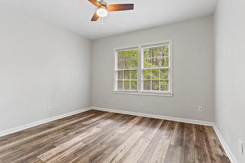 1268 Eastland Road Southeast, Unit B Atlanta, GA 30316 - Photo 14 of 20 an empty room with wooden floor and windows