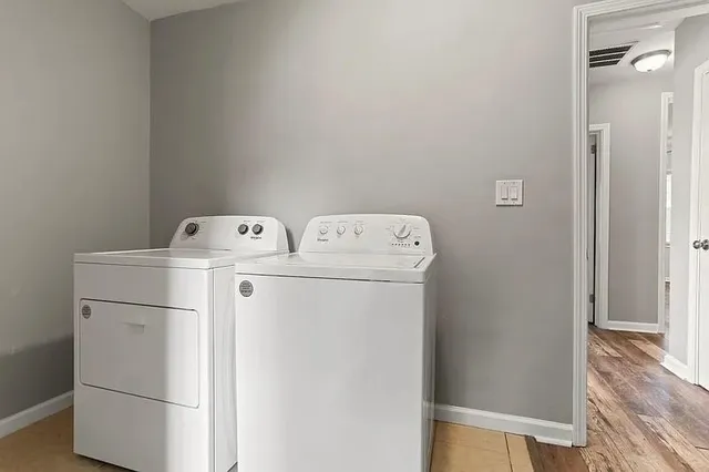 a view of balcony with wooden floor and fence
