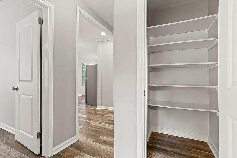 1268 Eastland Road Southeast, Unit B Atlanta, GA 30316 - Photo 5 of 20 a view of closet area with empty racks