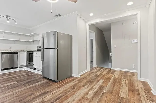 a view of kitchen space with wooden floor