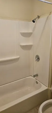 a bathroom with a bath tub