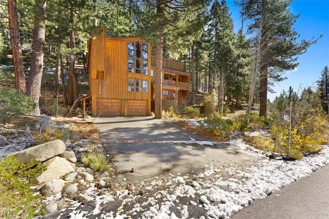 a view of a house with a snow in the yard