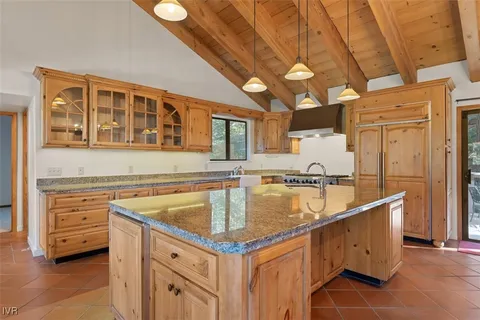 a kitchen with stainless steel appliances granite countertop a sink and cabinets