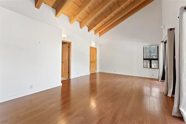 a view of a livingroom with wooden floor