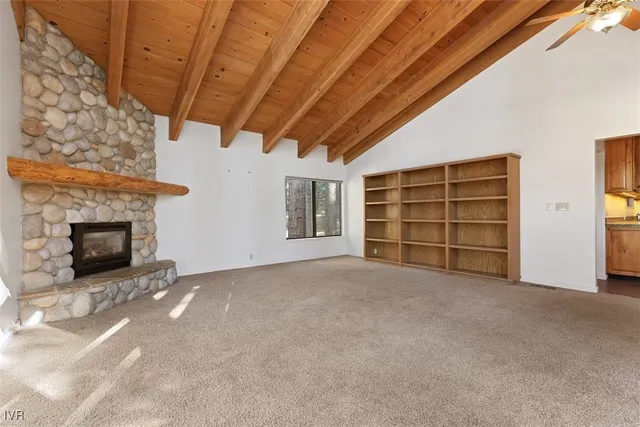 a view of an empty room with a fireplace