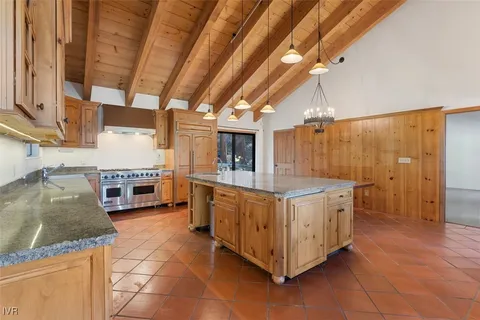 a kitchen with stainless steel appliances granite countertop a sink and cabinets
