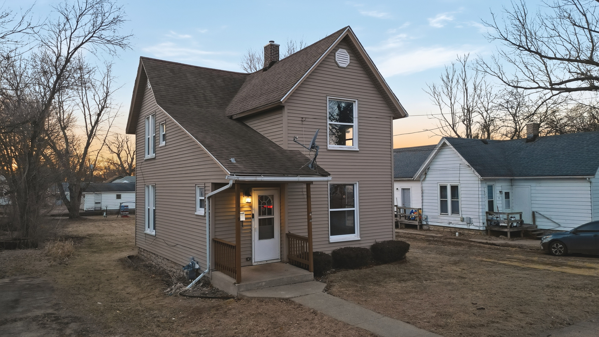 119 Douglas Avenue Dixon, IL 61021 - Photo 13 of 17 a front view of a house with a yard