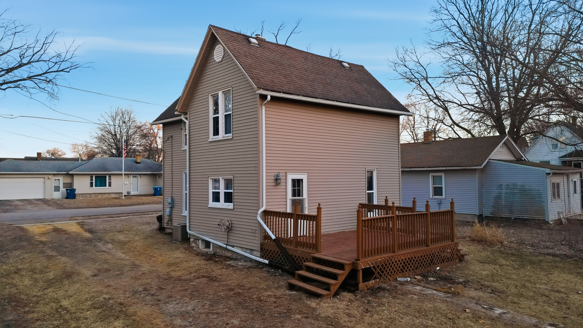119 Douglas Avenue Dixon, IL 61021 - Photo 14 of 17 a view of a house with a yard and wooden fence