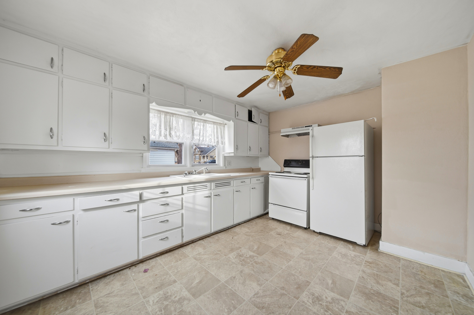 119 Douglas Avenue Dixon, IL 61021 - Photo 3 of 17 a kitchen with cabinets and window