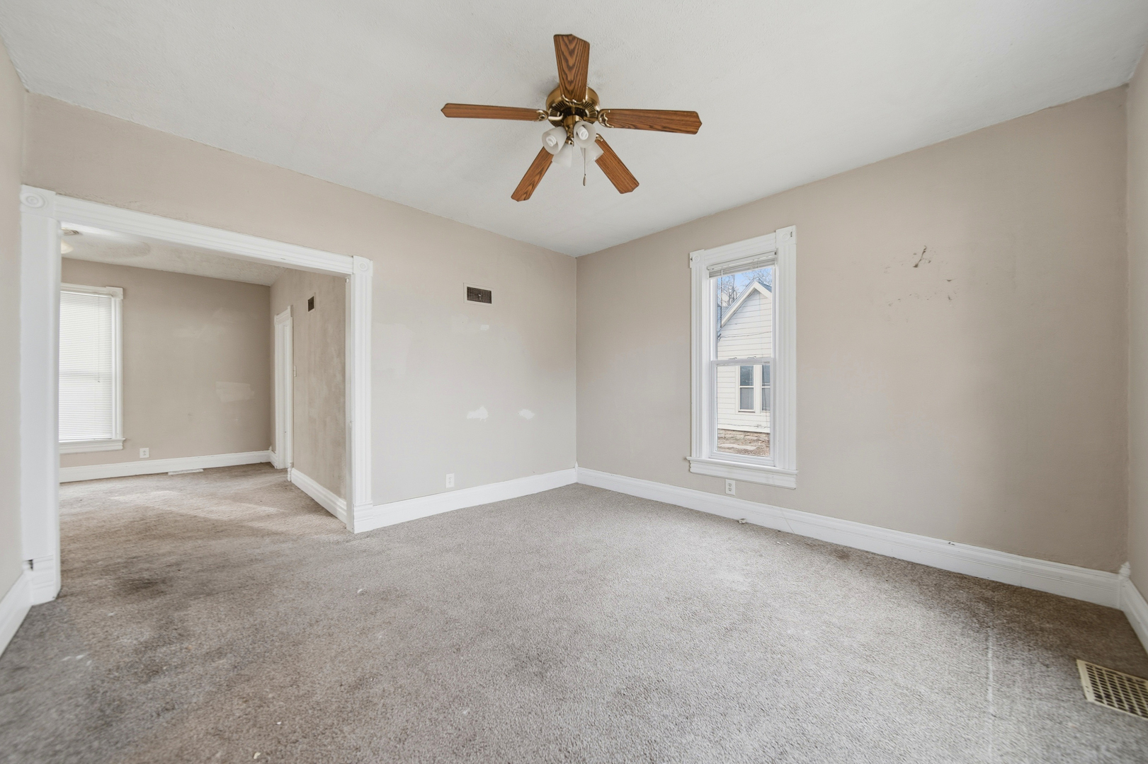 119 Douglas Avenue Dixon, IL 61021 - Photo 5 of 17 a view of an empty room with a window