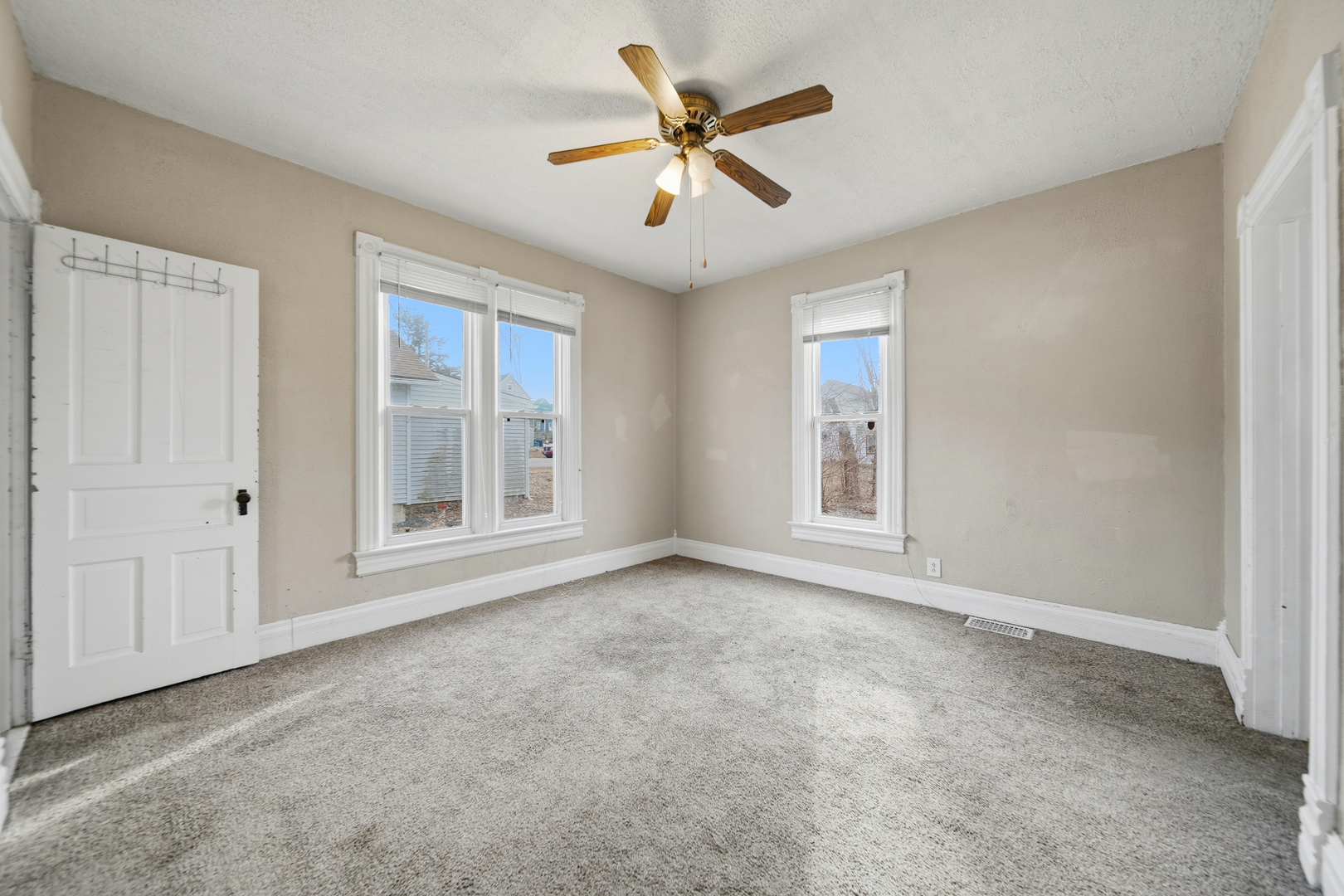 119 Douglas Avenue Dixon, IL 61021 - Photo 6 of 17 a view of an empty room with a window