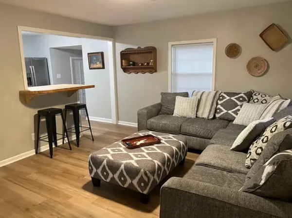a bedroom with a bed and dresser