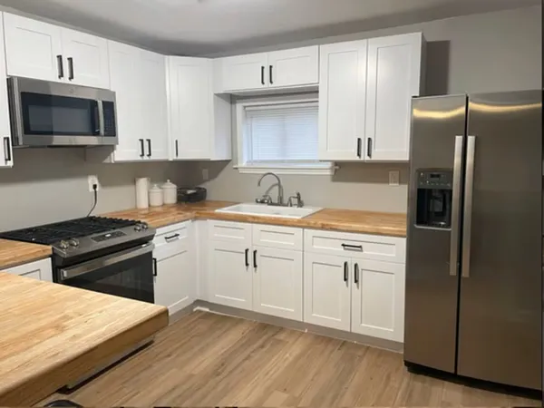 a kitchen with a stove microwave and refrigerator