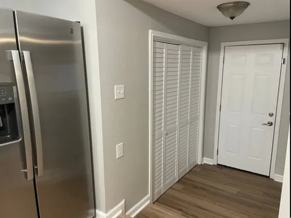 a view of bathroom with wooden floor