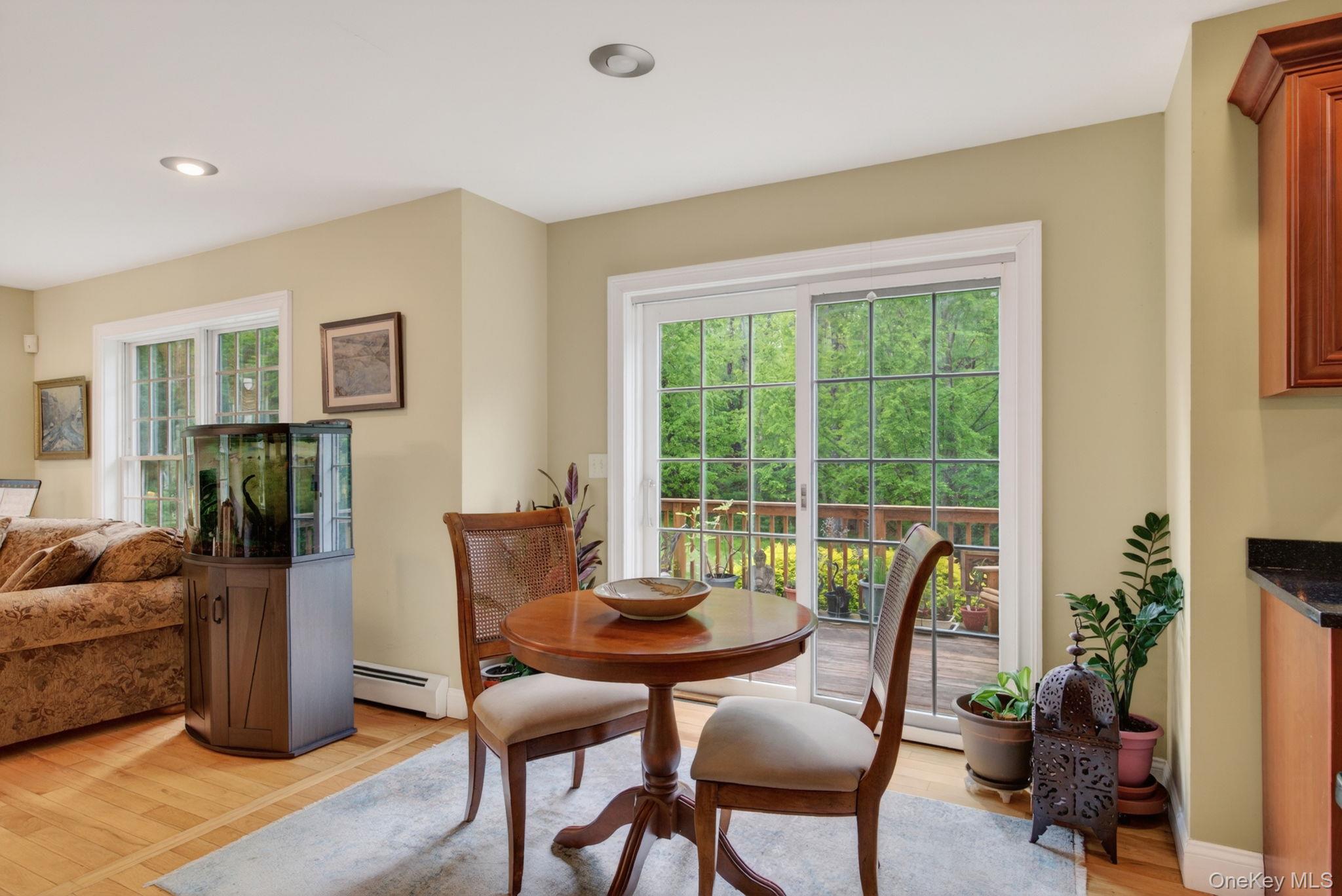 189 Bush Road Stone Ridge, NY 12484 - Photo 16 of 49 a dining room with furniture and potted plants