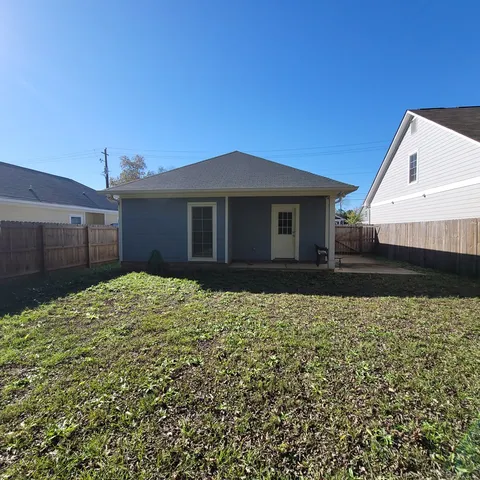 a house view with a backyard space