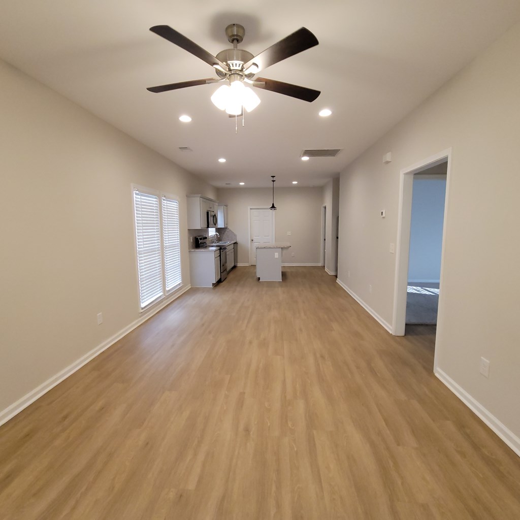 3604 4th Avenue Columbus, GA 31904 - Photo 3 of 19 a view of a livingroom with a ceiling fan & hardwood floor