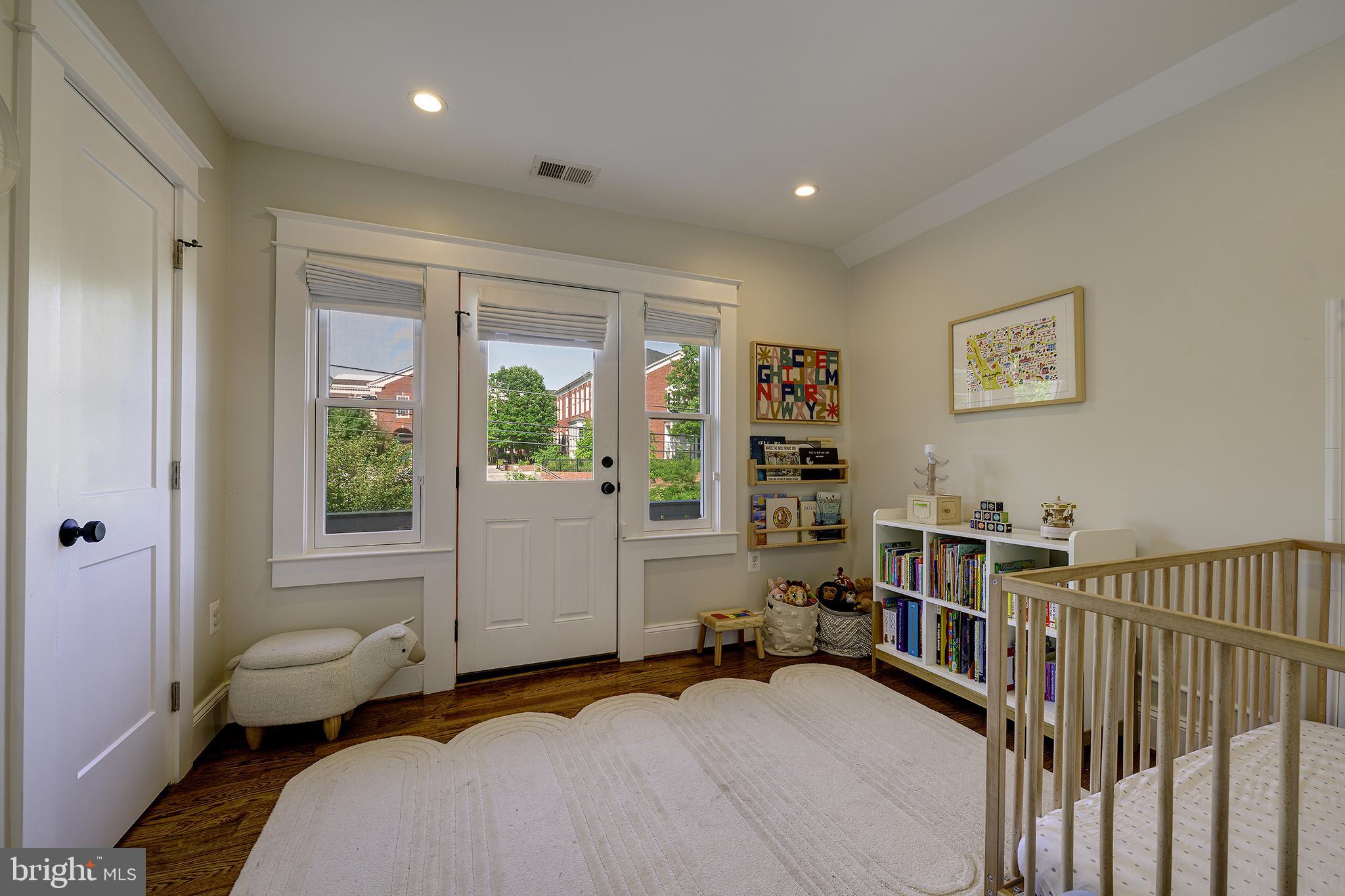 5710 Broad Branch Road Northwest Washington, DC 20015 - Photo 12 of 25 a bedroom with furniture and a window