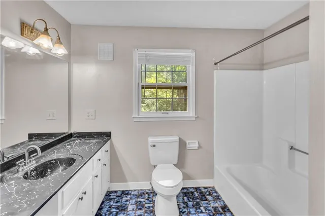a bathroom with a sink a toilet and a bathtub
