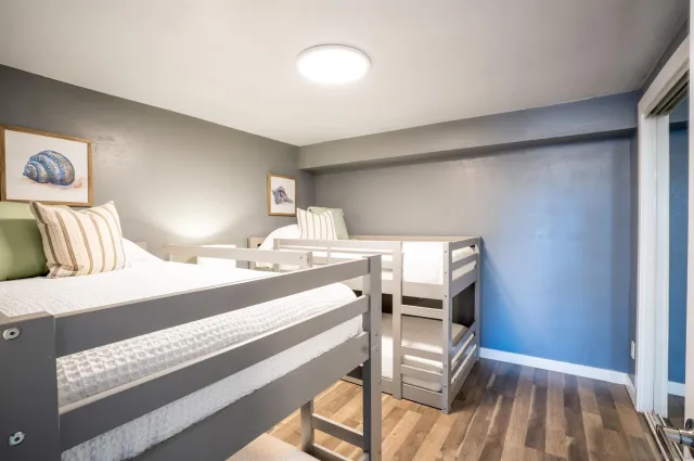 a bedroom with a bed and a table