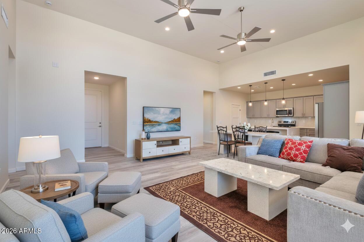 14825 Charco Road Arizona City, AZ 85123 - Photo 2 of 24 a living room with furniture and a view of kitchen
