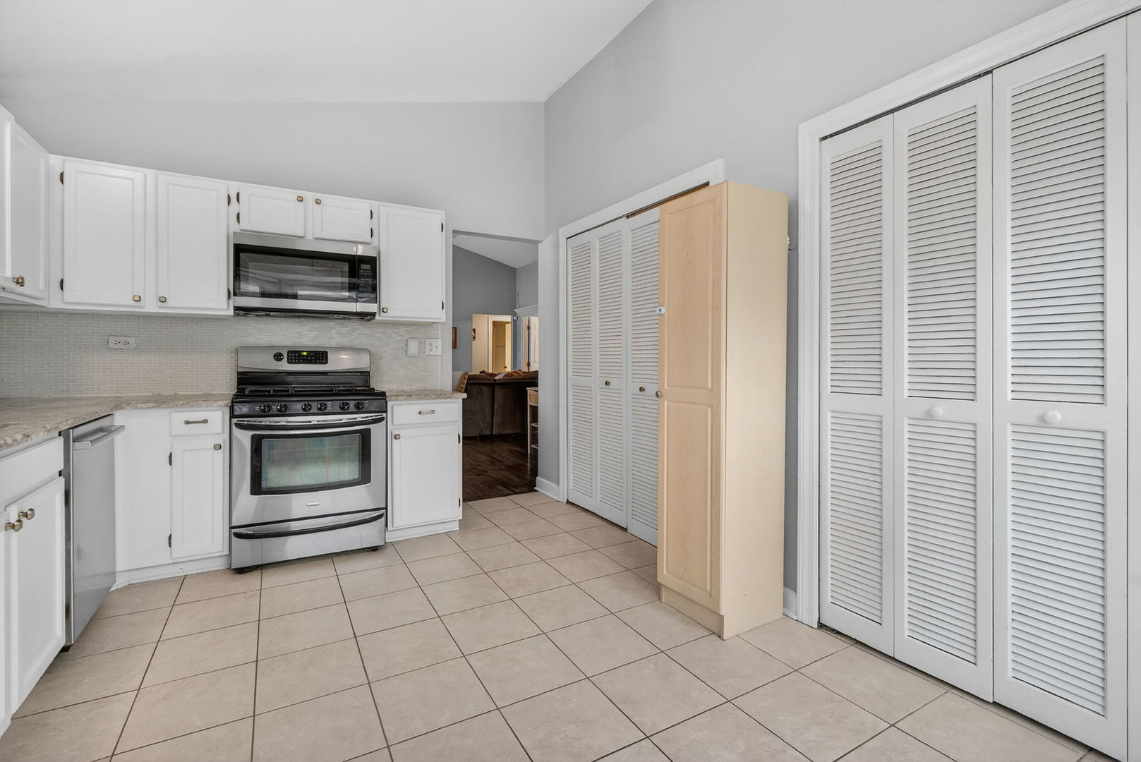 1412 Bar Harbour Road Aurora, IL 60504 - Photo 15 of 38 a kitchen with white cabinets and appliances