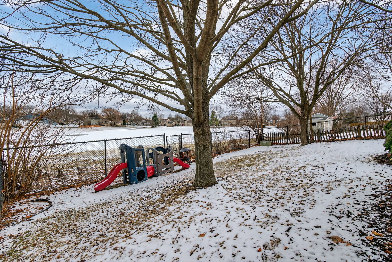 1412 Bar Harbour Road Aurora, IL 60504 - Photo 32 of 38 a view of a yard covered with snow