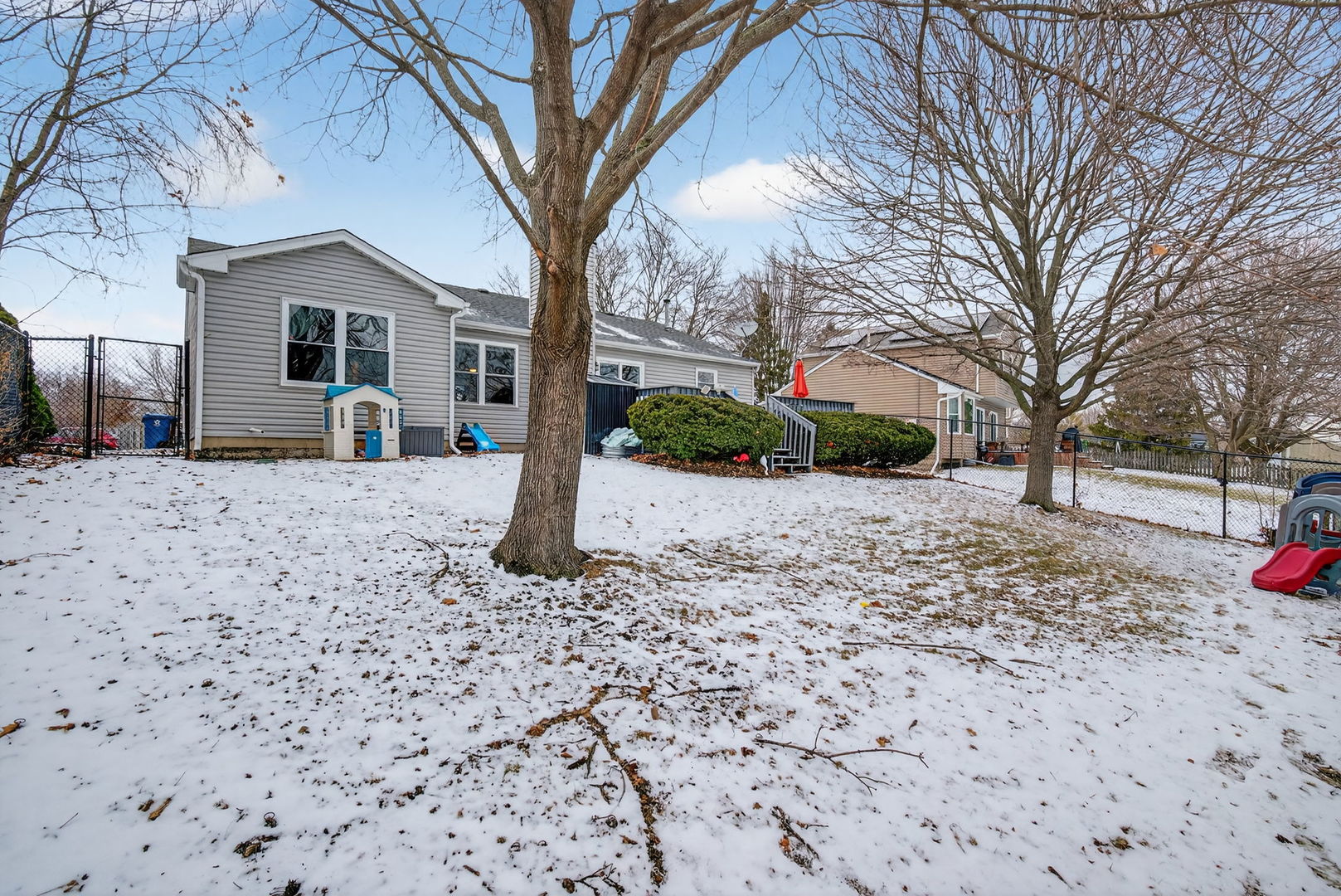 1412 Bar Harbour Road Aurora, IL 60504 - Photo 38 of 38 a front view of a house with a yard covered in snow