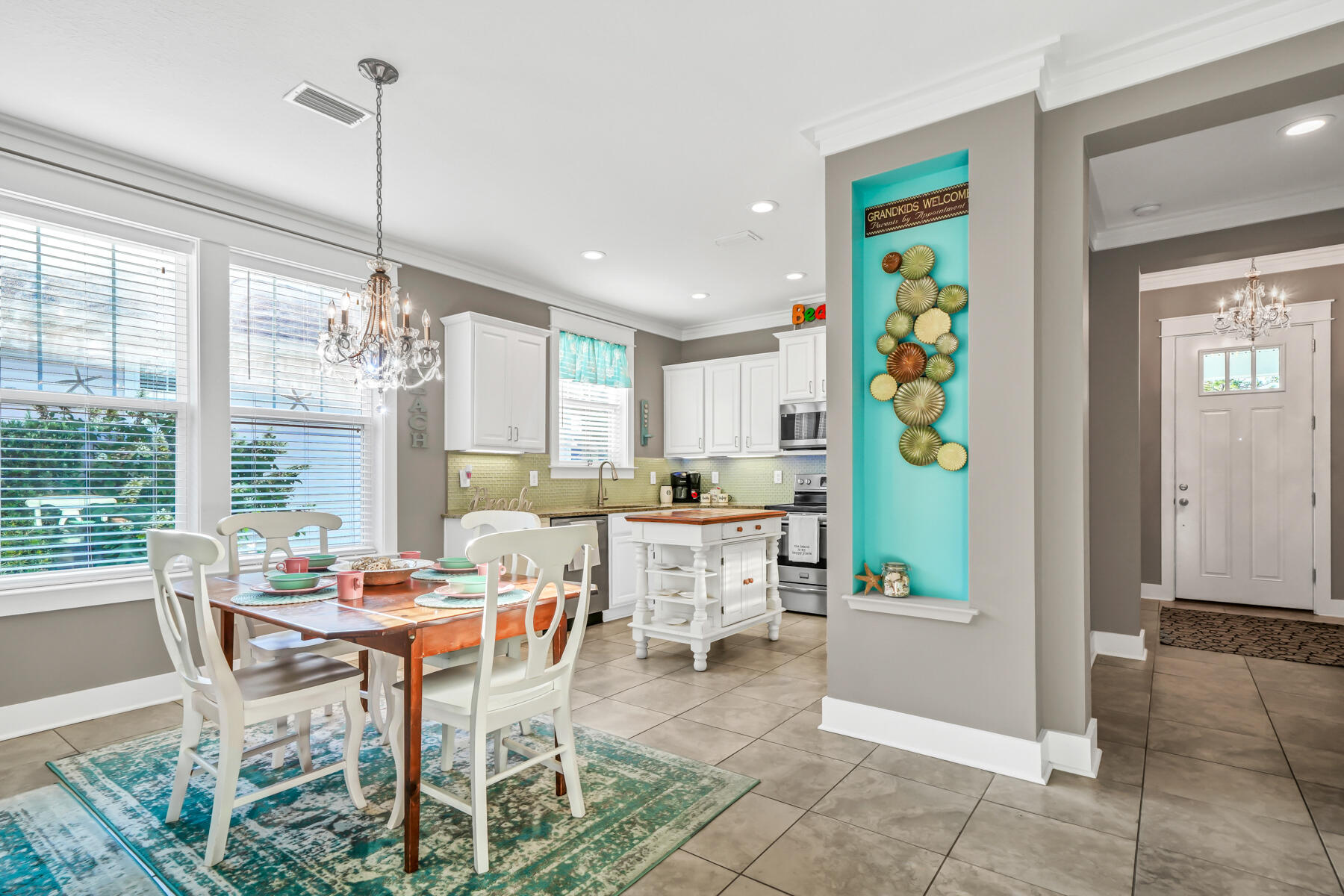 335 Blue Sage Road Panama City Beach, FL 32413 - Photo 11 of 34 a dining room with furniture and window