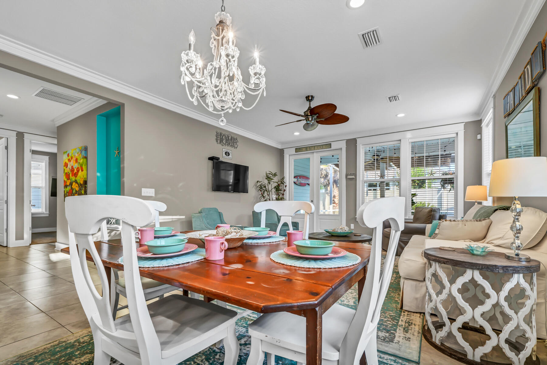 335 Blue Sage Road Panama City Beach, FL 32413 - Photo 12 of 34 a view of a dining room with furniture window and wooden floor