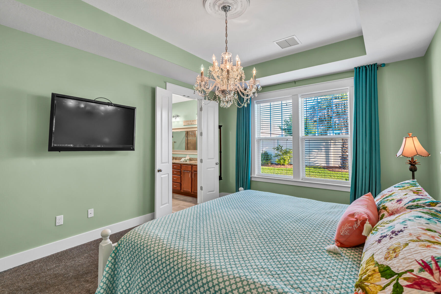 335 Blue Sage Road Panama City Beach, FL 32413 - Photo 18 of 34 a bedroom with a bed and a flat screen tv