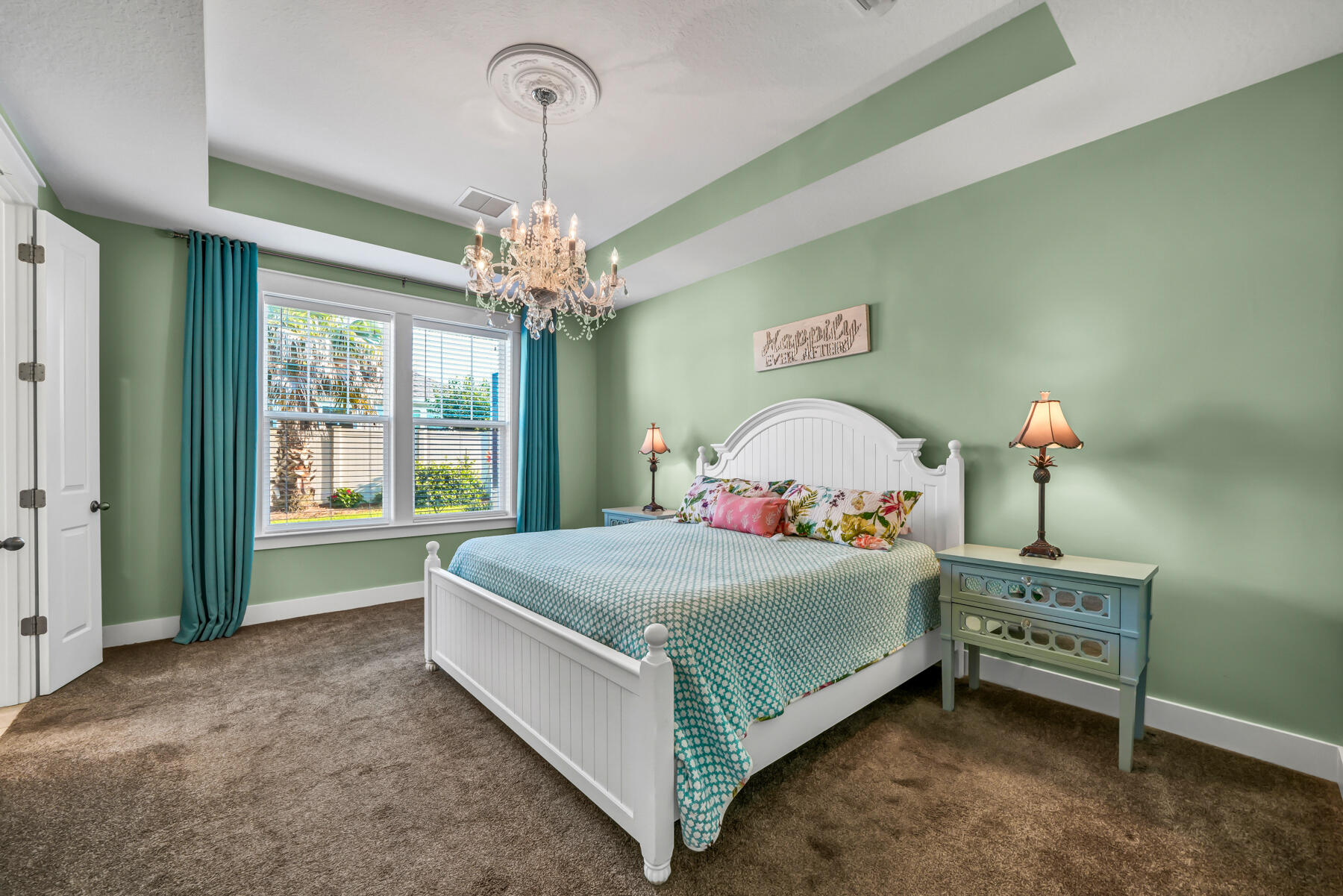 335 Blue Sage Road Panama City Beach, FL 32413 - Photo 19 of 34 a bedroom with a bed and a window