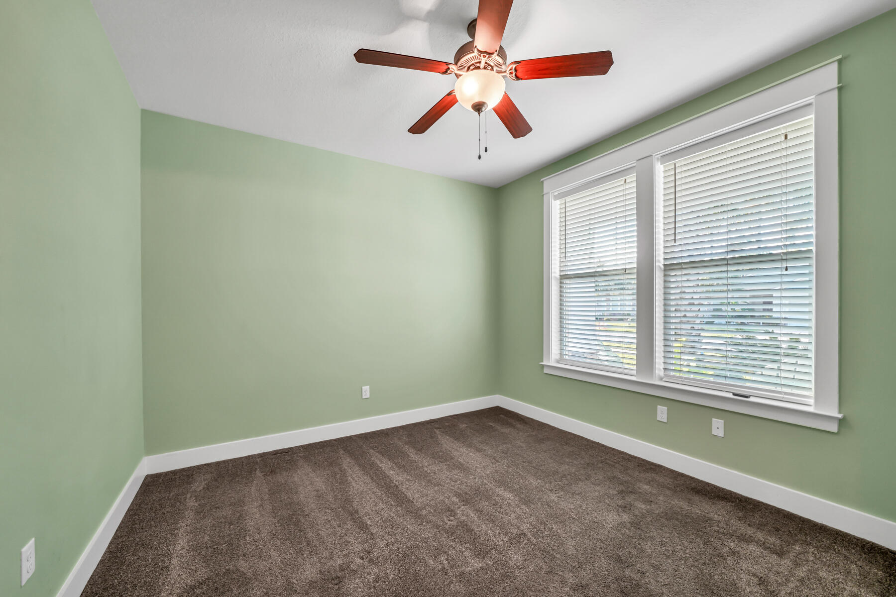 335 Blue Sage Road Panama City Beach, FL 32413 - Photo 22 of 34 an empty room with a ceiling fan and window