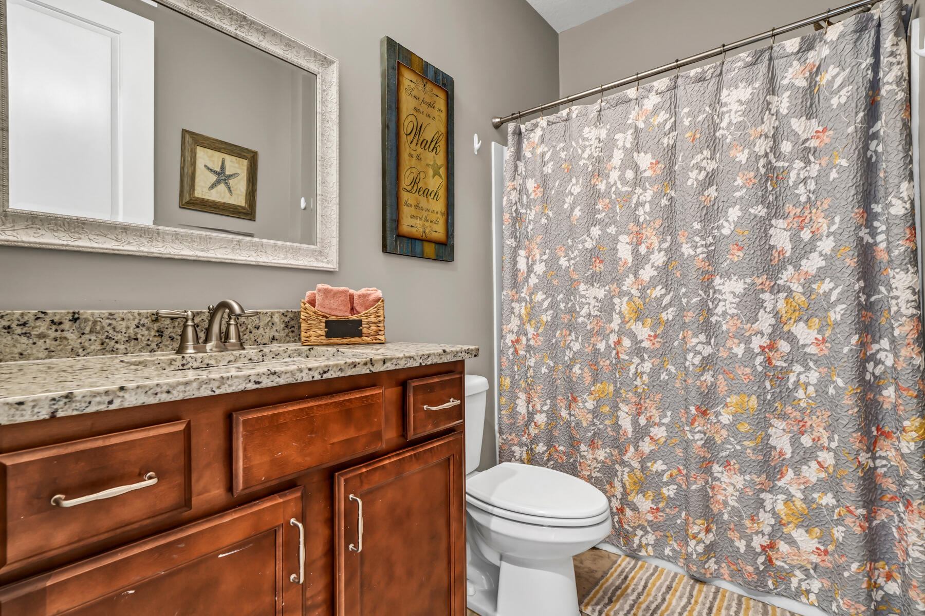 335 Blue Sage Road Panama City Beach, FL 32413 - Photo 25 of 34 a bathroom with a granite countertop sink mirror vanity and toilet