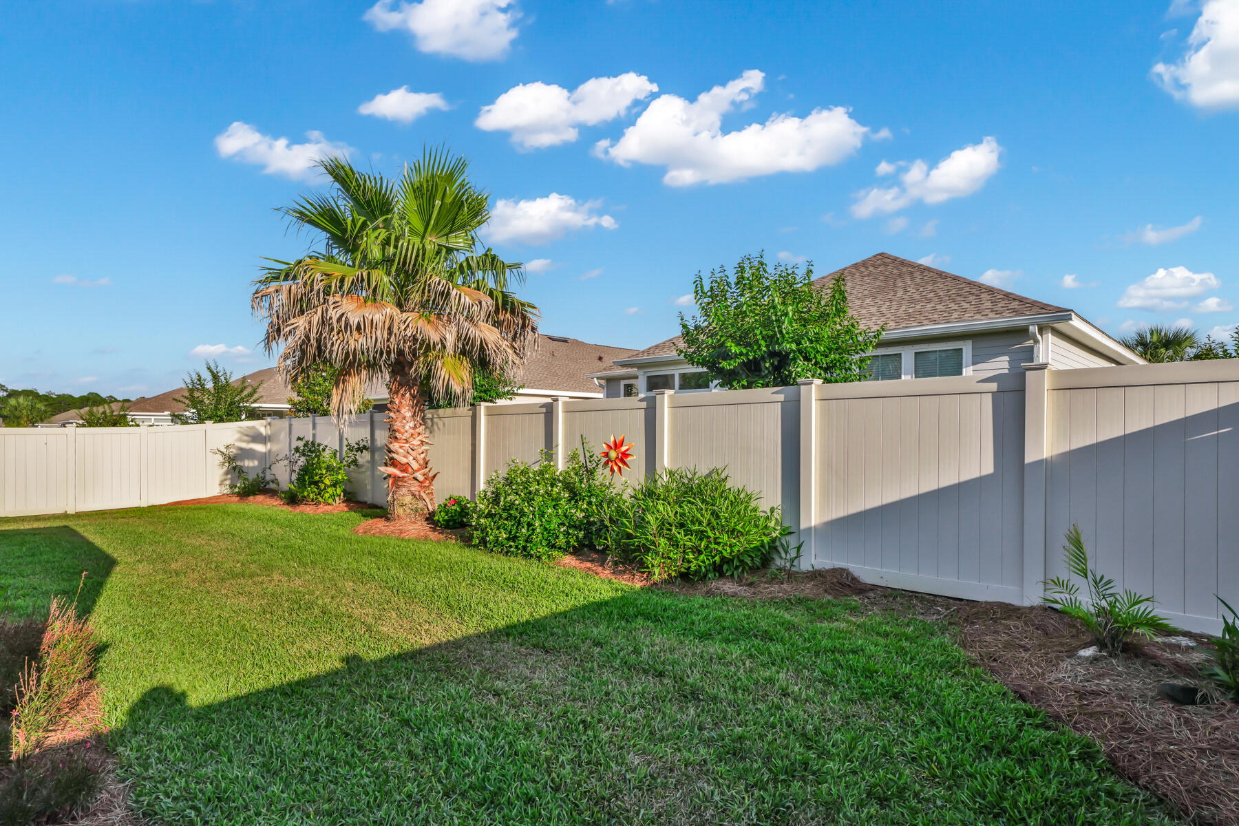 335 Blue Sage Road Panama City Beach, FL 32413 - Photo 29 of 34 a view of a yard with a house in the background