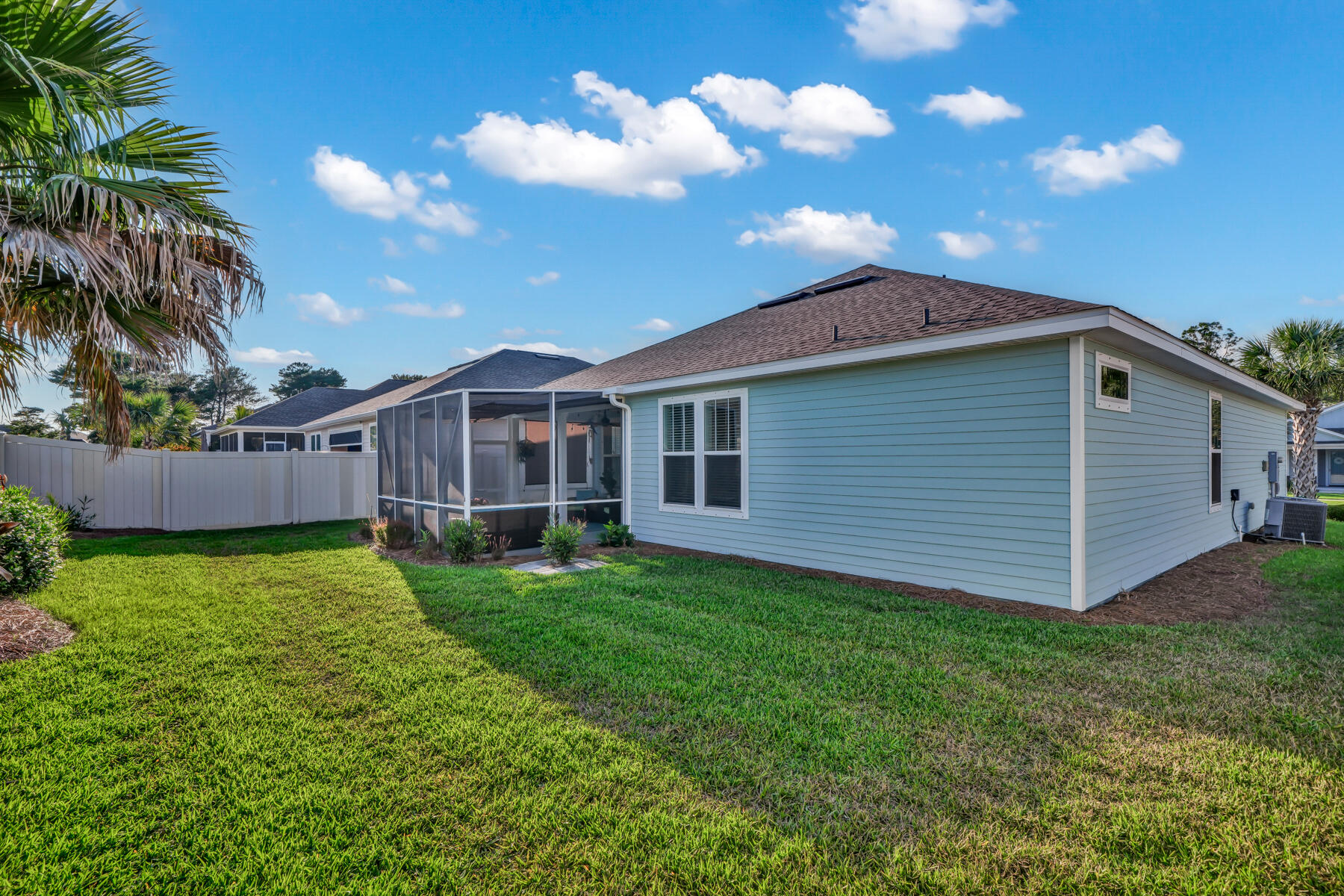 335 Blue Sage Road Panama City Beach, FL 32413 - Photo 31 of 34 a view of a house with a backyard