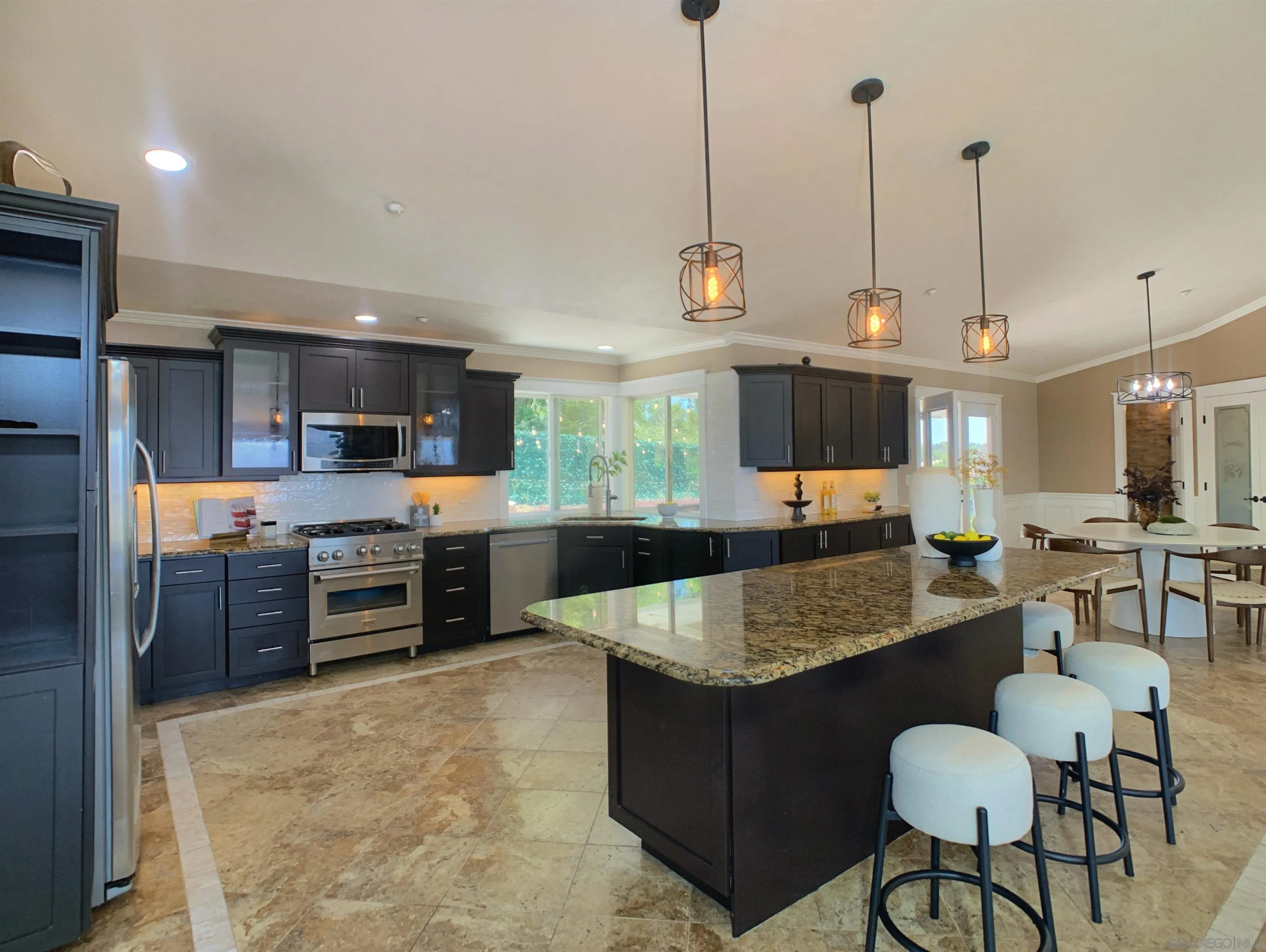 205 Highline Trail El Cajon, CA 92021 - Photo 9 of 45 a living room with stainless steel appliances kitchen island granite countertop furniture and a kitchen view