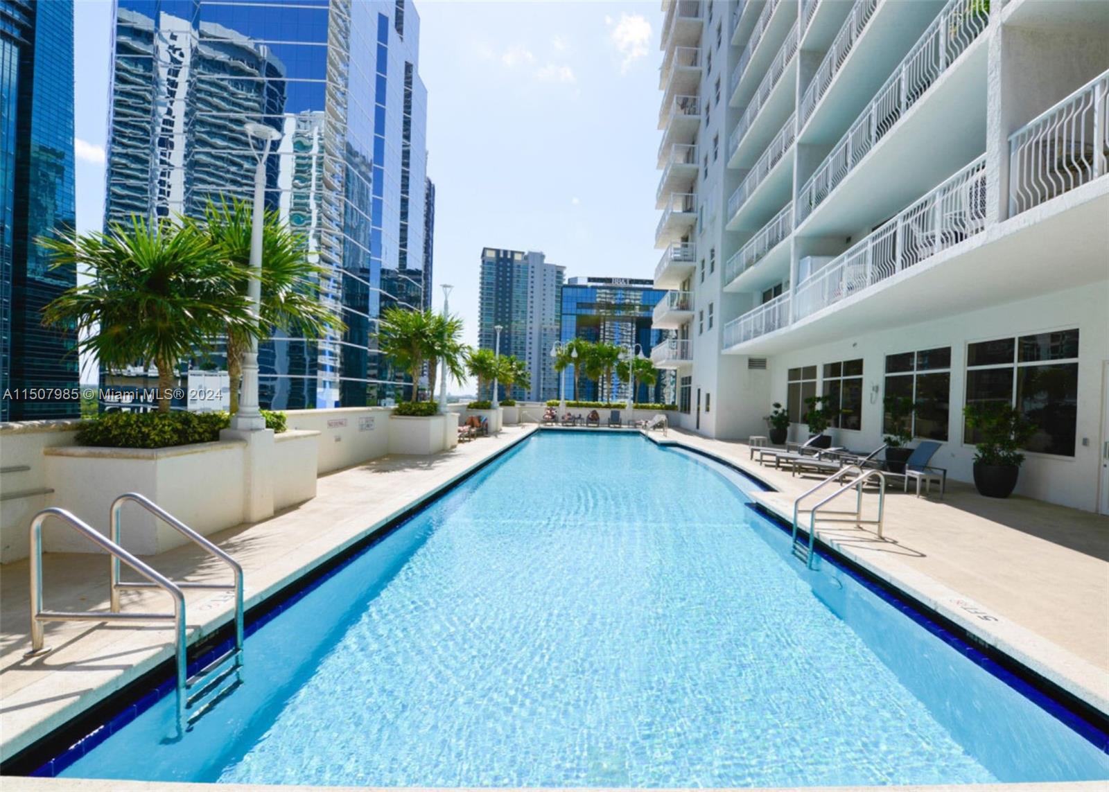 a view of swimming pool with outdoor seating and a buildings view