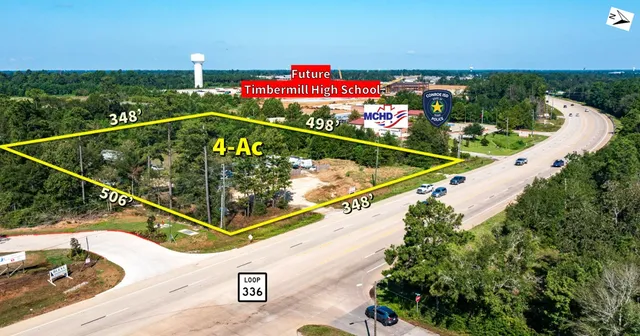 a view of a balcony and yard