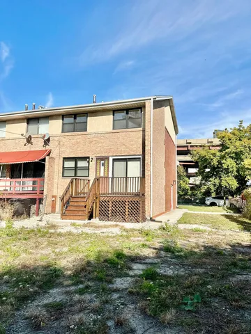 a front view of building with a garden