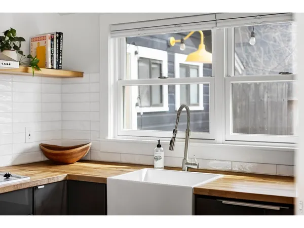 a kitchen with a sink and a window
