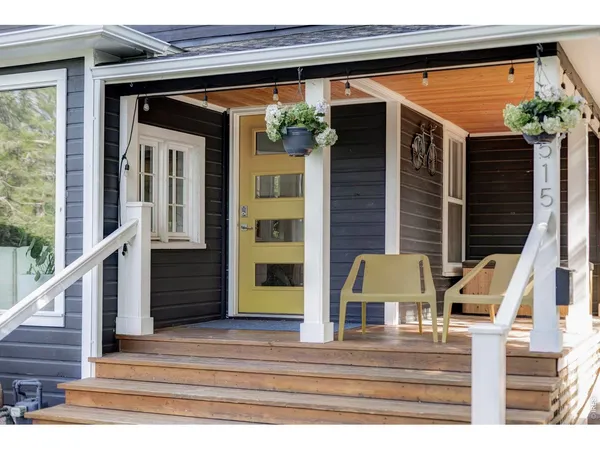 a view of front door and potted plants