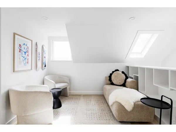 a bedroom with a bed and a painting