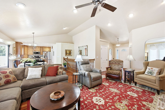 776 Flint Street Layton, UT 84041 - Photo 9 of 41 Vaulted ceilings enhance this living area featuring wood-finish flooring and recessed lighting